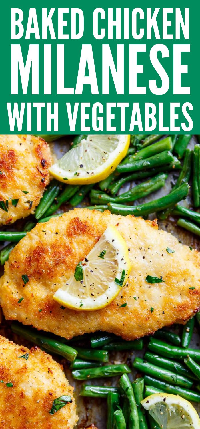 baked chicken with green beans and lemons on a plate