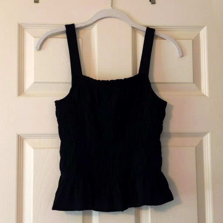 Rouched, Stretchy Top. Ruffled Bottom, 100% Cotton. Nwot Black Sleeveless Top With Smocked Back, Black Ruched Tank Top For Summer, Chic Black Ruched Tank Top, Black Ruched Sleeveless Top, Black Sleeveless Ruched Top, Casual Black Ruched Tank Top, Black Ruched Cami Top, Black Cami Tank Top With Ruffles, Black Ruffled Cami Tank Top