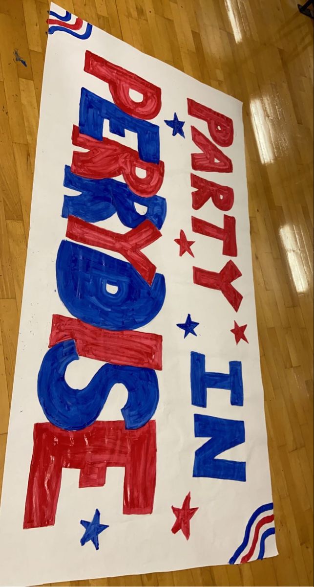 a sign on the floor that says party in red, white and blue with stars