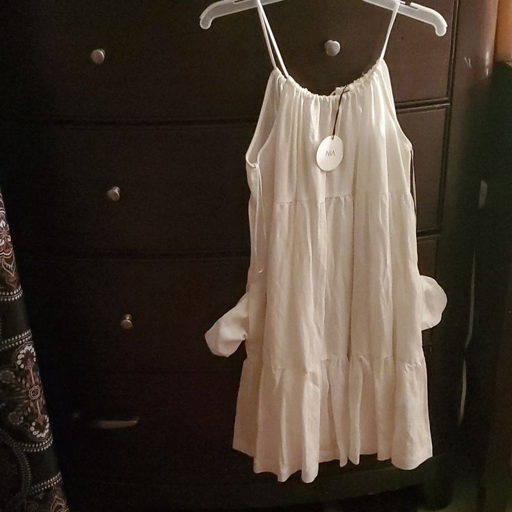 Nia Brand Size L 60% Tencel 40% Linen White Breezy Tiered Dress For Spring Day Out, Breezy Ruffled Midi Dress, Feminine Knee-length Mini Dress For Daytime, White Casual Tiered Dress For Summer, White Flowy Tiered Dress For Vacation, Flowy Tiered Sundress For Brunch, Casual White Tiered Dress For Summer, Flowy White Tiered Dress For Vacation, Feminine A-line Sundress For Vacation