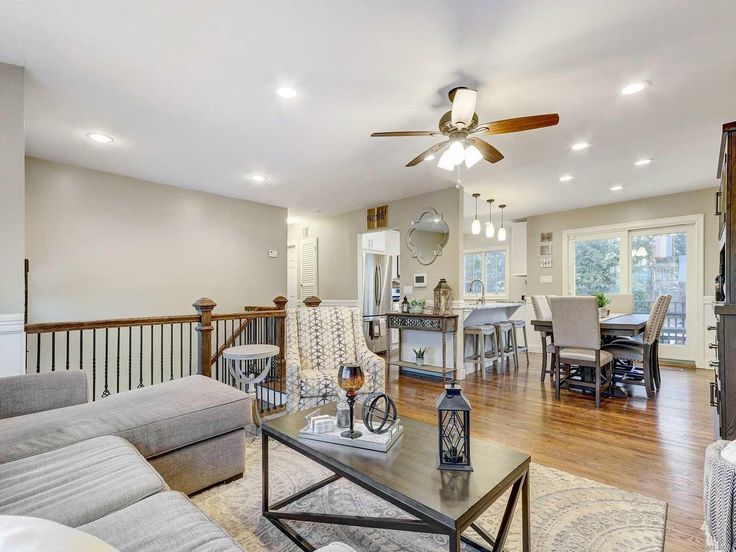 a living room filled with furniture and a fire place