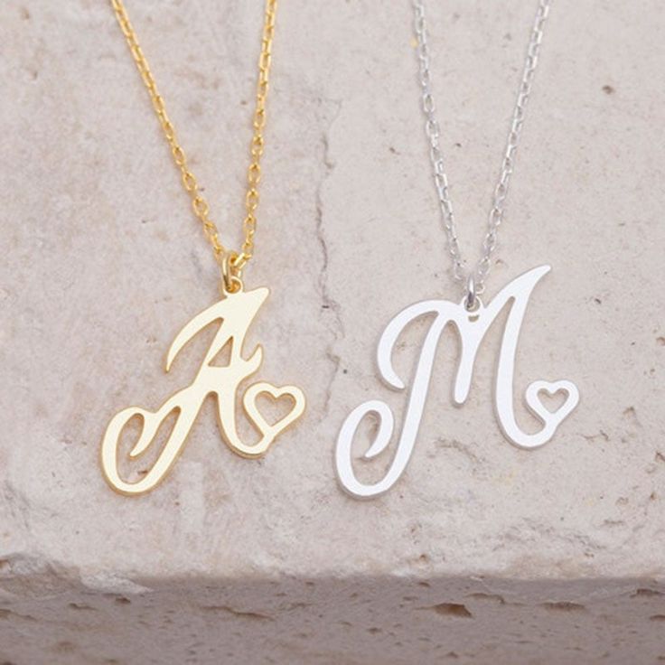 ✨ Introducing the stunning Initial Letter Necklace—a dazzling piece that adds a personal touch to your style! ✨ 🌟 Personalized Charm: Each necklace is delicately crafted to resemble your chosen initial, culminating in an adorable heart-shaped pendant. 💎 Alphabet Variety: Available for all letters from A to Z, ensuring everyone can find their perfect match. ✨ Elegant Finishes: Choose between radiant gold for warmth and luxury or timeless silver for purity and versatility. 🌈 Embrace the essence Necklaces Cheap, Letter Necklace Initials, Initial Heart Necklace, Initial Letter Necklace, Initial Necklaces, Letter Pendant Necklace, Initial Pendant Necklace, Custom Name Necklace, Letter Pendants