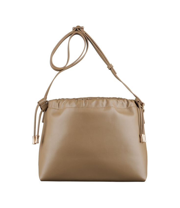 A.P.C. Women's bag.- Recycled leather-like material. - Magnetic inside closure. - Drawstring closure on top. - Shoulder strap to wear the bag on the shoulder or across the chest. - One interior pocket. - Goldtone 'A.P.C. rue Madame Paris' logo embossed on the front. - In the Ninon product line. Beige Flap Bag With Adjustable Strap For On-the-go, Chic Khaki Satchel Shoulder Bag, Rectangular Khaki Shoulder Bag With Adjustable Strap, Khaki Bucket Bag With Adjustable Strap, Khaki Shoulder Bag With Removable Pouch For On-the-go, Khaki Shoulder Bag With Adjustable Strap, Chic Khaki Shoulder Bag With Removable Pouch, Chic Khaki Shoulder Bag Satchel, Chic Khaki Shoulder Satchel