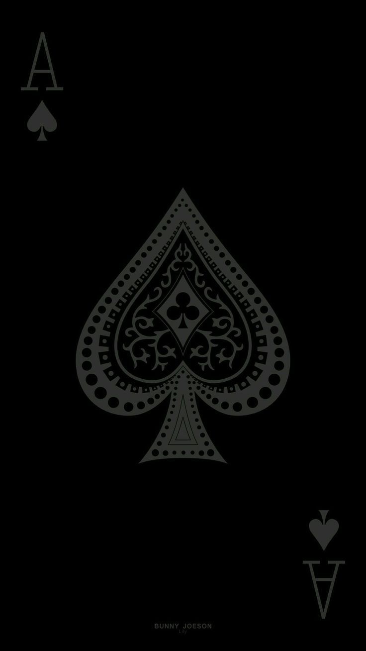 an ace playing card in black and white, with the back side showing two spades