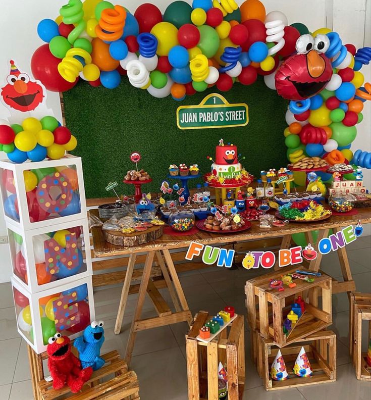 a sesame street birthday party with balloons and decorations