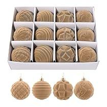 twelve cookies in a white box with ornaments