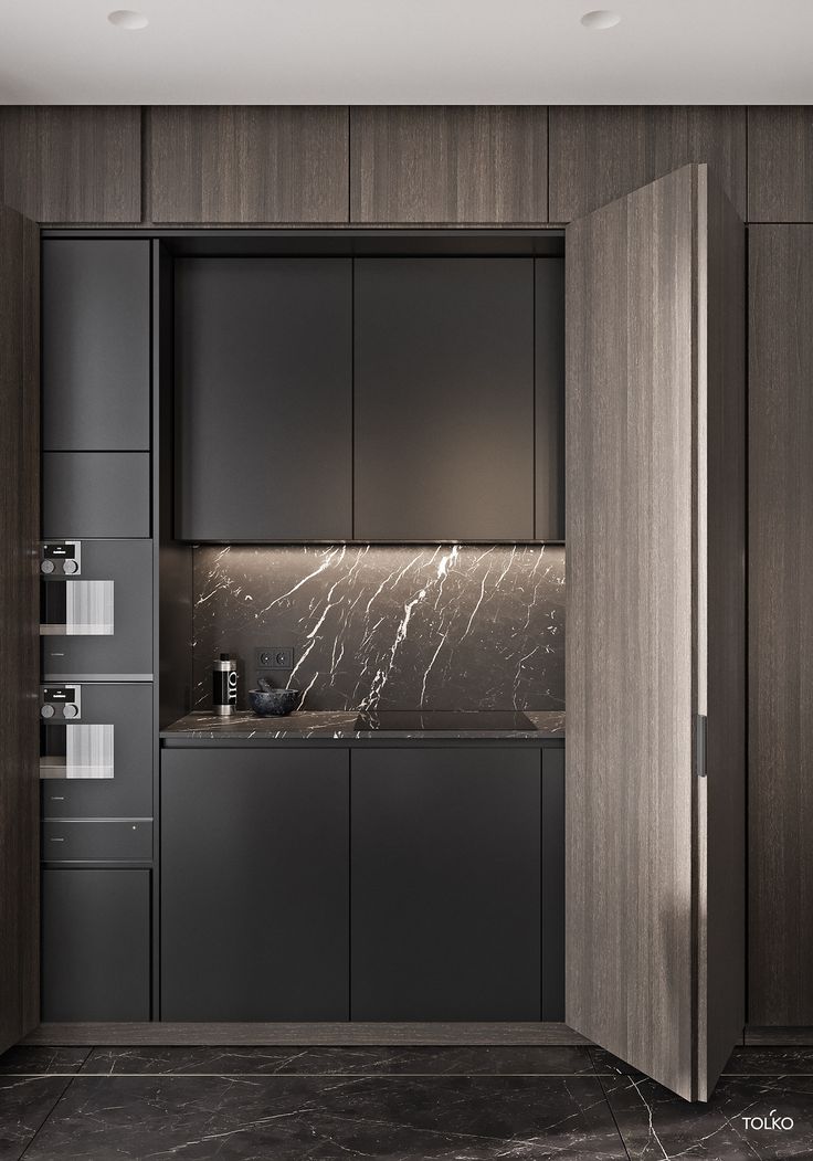 a modern kitchen with marble counter tops and cabinets in dark wood, black and white