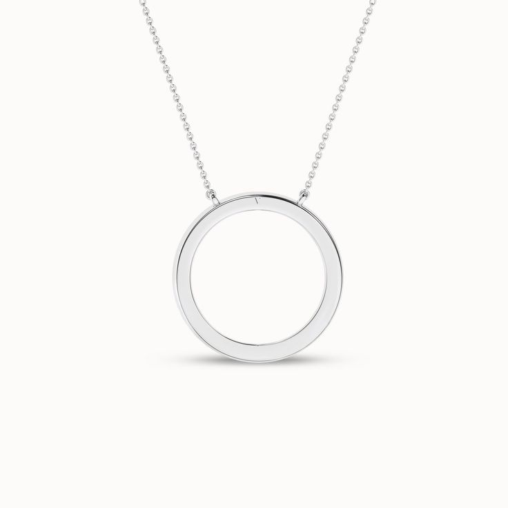 The Circular Silhouette Necklace is a testament to timeless style. It has a diamond-studded circular pendant that captures the essence of enduring love. This piece transforms any ensemble into a captivating look. It’s more than just a necklace; it’s a circle of endless possibilities. Timeless Diamond Pendant Necklace, Sterling Silver Diamond Pendant Necklace With Halo, Timeless Diamond Necklace With Round Pendant For Formal Occasions, Elegant Silver Open Circle Necklace, Classic Halo Diamond Necklace With Round Pendant, White Gold Round Jewelry With Polished Finish, Modern Diamond Cut Pendant Necklace, White Gold Diamond Jewelry With Timeless Design, Elegant Open Circle Silver Necklace