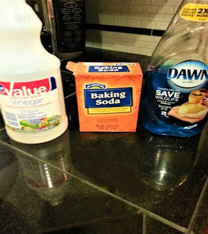 baking soda, baking soap and baking powder are on the counter