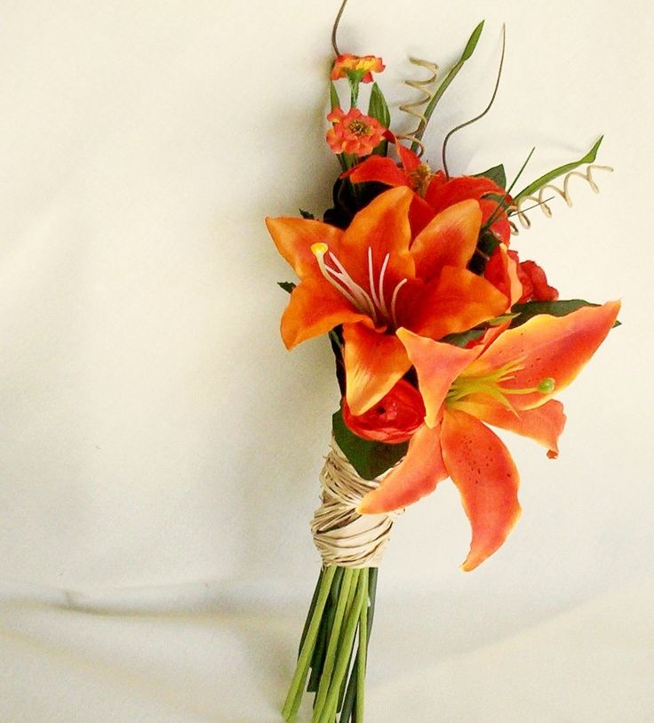 a bouquet of orange flowers on a white background