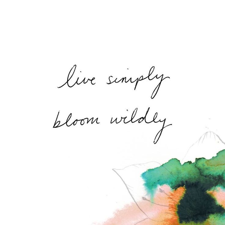 the words live simply bloom wildly are written in black ink on a watercolor background