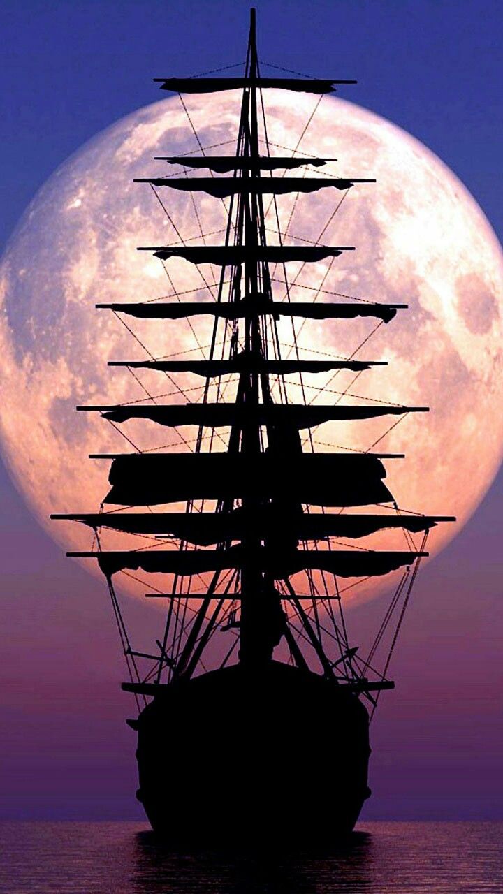 a full moon is in the sky behind a ship on the water with it's sails down