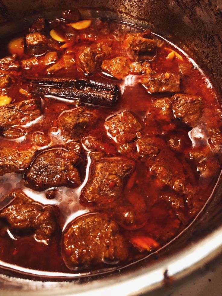 meatballs and carrots are cooked in the slow cooker to make an entree