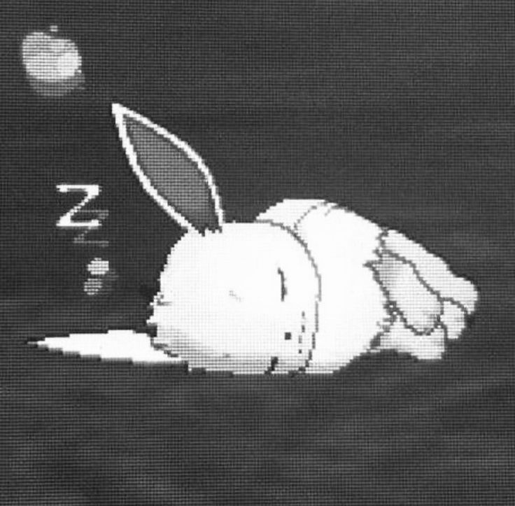 a white rabbit is laying on the ground with its head in the air and it's eyes closed