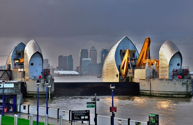 the boats are docked at the dock in front of the city