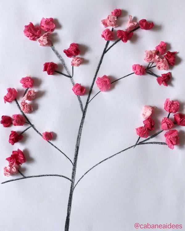 the paper flowers are made to look like branches