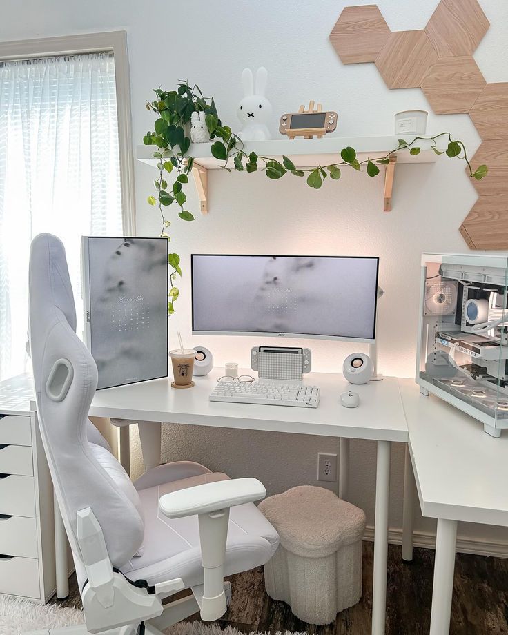 a computer desk with two monitors and a chair in front of it on top of a rug