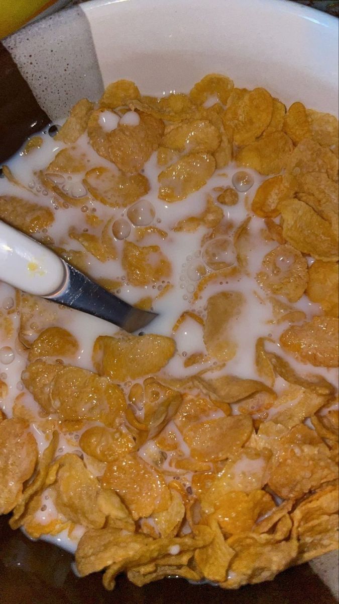 cereal and milk are mixed together in a bowl