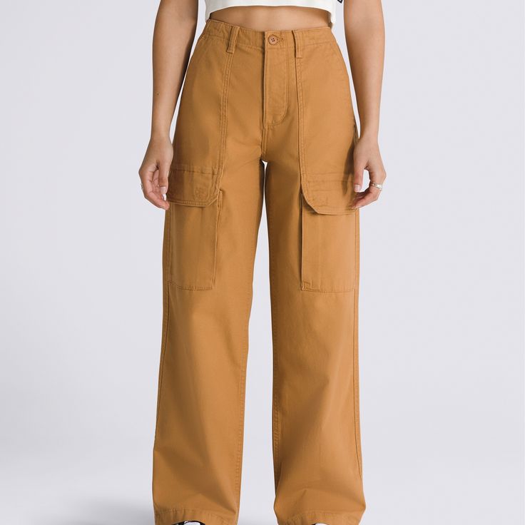 The Arroyo Wide Leg Cargo Pants is a classic workwear inspired piece with a modern style in an all-new hue. These canvas pants offer lots room, lots of style, and lots of storage with its wide-legged style and plethora of pockets. 100% Cotton fabric Relaxed fit canvas wide leg cargo pant Front and back patch pockets Side cargo pockets 12.5'' rise 28'' inseam 15.5'' leg opening | Vans Arroyo Wide Leg Cargo Pants Womens 26 Inch Cheap Wide-leg Cargo Pants For Fall, Luxury Wide Leg Brown Cargo Pants, Luxury Brown Wide Leg Cargo Pants, Plaid Stockings, Classic Workwear, Wide Leg Cargo Pants, Canvas Pants, Workwear Fashion, Pants Womens