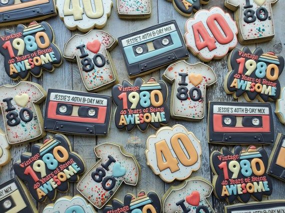 decorated cookies with the words 80 and an old school cassette player on them are displayed