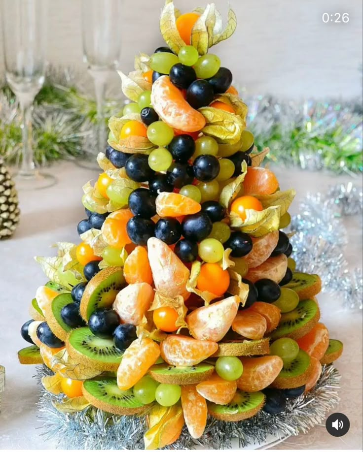 a christmas tree made out of fruits and vegetables