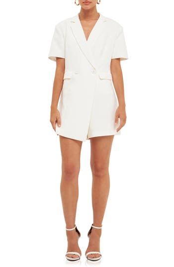 Polished meets charm on this tailored romper designed in a double-breasted silhouette with abbreviated sleeves. Notched lapels Short sleeves Lined 100% polyester Hand wash, dry flat Imported Elegant White Short Sleeve Jumpsuits And Rompers, Elegant Short Sleeve Formal Jumpsuits And Rompers, Chic Summer Blazer Dress With Lapel Collar, Elegant Short Sleeve Jumpsuits And Rompers For Office, Spring Workwear Jumpsuits And Rompers, Short Length, Chic Short Sleeve Jumpsuit For Office, Coverall Jumpsuit, Romper Designs, Hairstyling Products