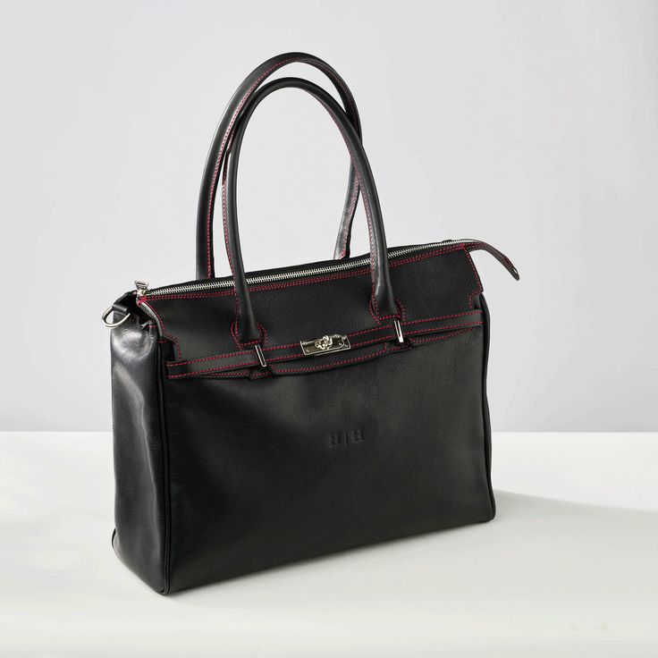 The Allegra Tote Bag is a generously sized everyday carryall and was intentionally designed to keep you organized. With many internal compartments, an exterior pocket with luggage strap, comfortable shoulder handles and shoulder strap and elegant design, it's quite possibly the perfect work and travel bag. The luxurious pebbled calfskin leather is truly eye-catching and becomes more supple over time. Comes with Hektor + Helena's Lifetime warranty and guarantee. Made of Italian vegetable tanned l Everyday Luggage With Leather Double Handles, On-the-go Briefcase With Double Handle, Top Handle Laptop Bag For Travel, Travel Briefcase With Double Handle, Elegant Shoulder Bag With Luggage Sleeve For On-the-go, Luxury Laptop Bag With Large Capacity For Daily Use, Luxury Large Capacity Laptop Bag For Daily Use, Functional Double Handle Briefcase For Everyday Use, Travel Briefcase With Removable Pouch Satchel