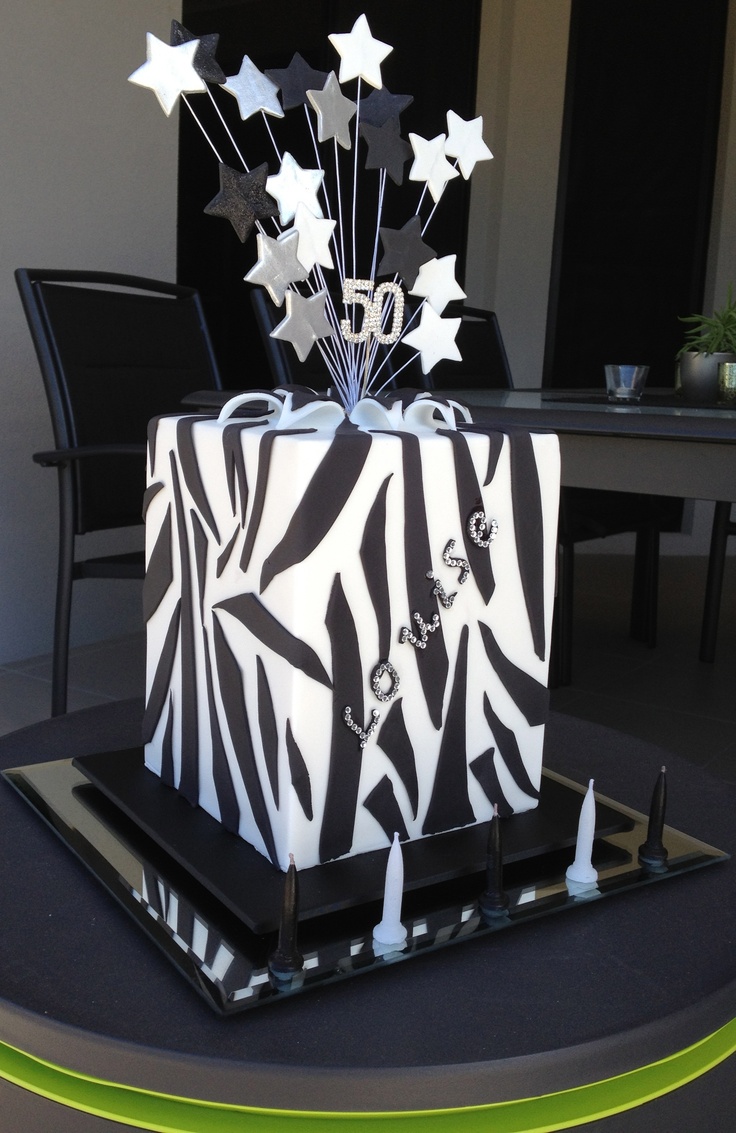 a zebra print present box with white stars on it