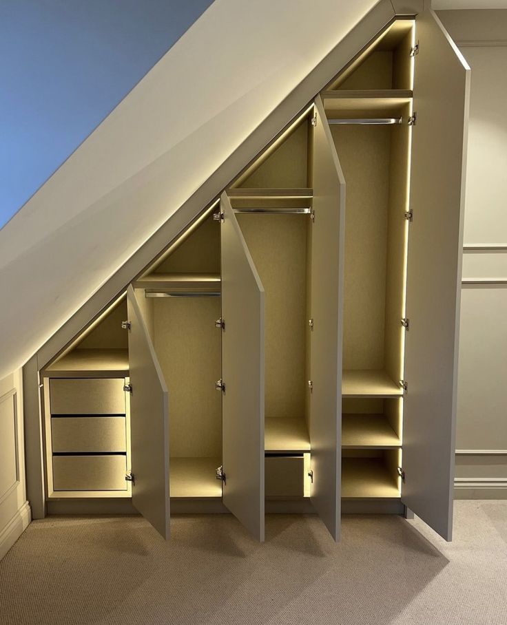 an attic closet with open doors and shelves