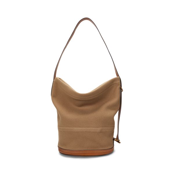 This slouched version of our Bellport bucket bag is designed with an adjustable strap that allows for styling as a sling or shoulder bag. Crafted with wool-blend flannel and full-grain leather trim the versatile silhouette showcases highly considered details including a top zip closure engraved brass hardware and a structured circular base. It’s accented with our gold foil-embossed signature logo for an unmistakable Polo finish. Daily Use Leather Trim Bucket Shoulder Bag, Daily Use Bucket Shoulder Bag With Leather Trim, Canvas Crossbody Bucket Bag With Leather Trim, Daily Use Bucket Hobo Bag With Leather Trim, Bucket Bag In Coated Canvas With Leather Trim, Bucket Bag With Leather Trim In Coated Canvas, Leather Trim Shoulder Bucket Bag For Shopping, Bucket Bag With Leather Trim And Coated Canvas, Modern Leather Trim Bucket Shoulder Bag