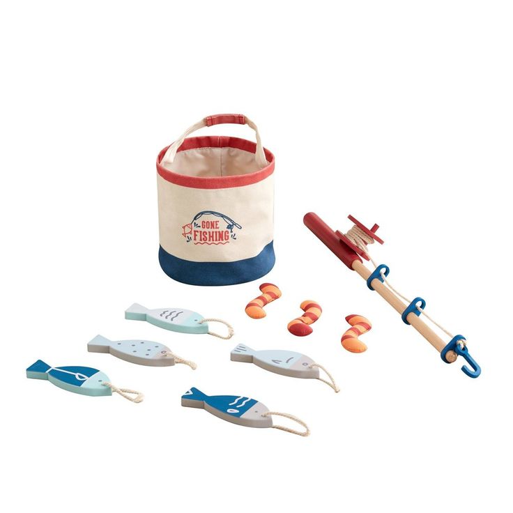 an assortment of toys including toothbrushes and tongs in a tote bag