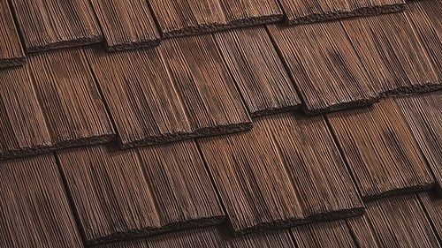 a close up view of a roof made of wood shingles with no one on it