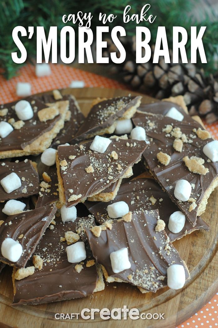 there are marshmallows and chocolate on the plate with text that says easy no bake s'mores bark