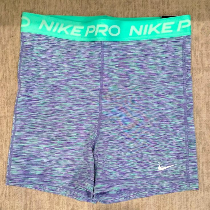 Up For Sale Are Nike Women's Training Shorts In Blue Space Dye. These Shorts Are Perfect For Any Athletic Activity, Whether It's Running, Going To The Gym, Practicing Yoga, Or Any Other Sports Workout. The Shorts Are Designed To Fit Comfortably, With A Regular Size And An Athletic Fit That Flatters Your Figure. The Shorts Come With Tags And Are In Brand New Condition. The Nike Brand Speaks For Itself, As It Is Known For Its High-Quality Products That Are Designed To Last. The Shorts Come In A Be Nike Sporty Yoga Bottoms, Sporty Nike Yoga Bottoms, Nike Blue Athletic Shorts For Sports Season, Nike Sporty Shorts For Yoga, Nike Sporty Yoga Shorts, Nike Casual Athletic Shorts For Yoga, Sporty Nike Shorts For Yoga, Purple Short Leg Sports Bottoms, Blue Nike Athletic Shorts For Gym