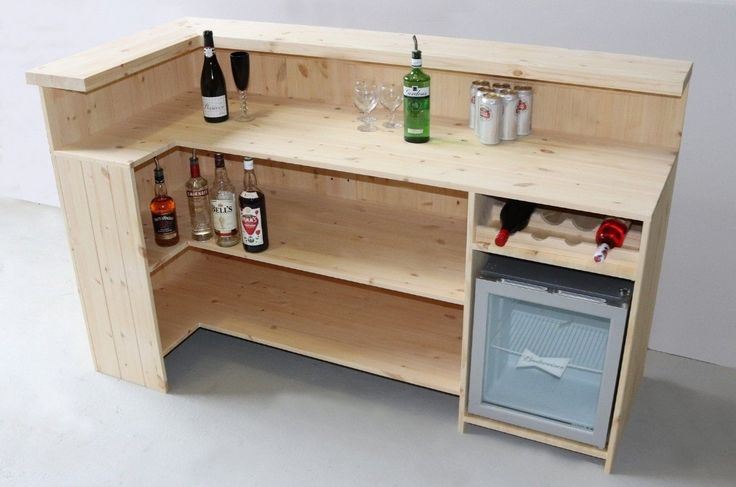 a wooden shelf with bottles and glasses on it next to an open wine glass cabinet