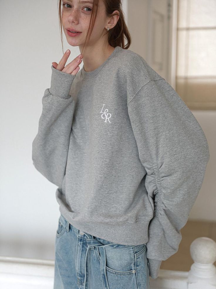 This product showcases a classic crewneck sweatshirt with a graphic print that adds a touch of personality to the casual design. The relaxed fit and ribbed trims provide a comfortable, snug feel, suitable for everyday wear. With its soft interior, this sweatshirt is perfect for lounging or casual outings, making it a versatile addition to any wardrobe. - The sweatshirt is crafted with a soft, fleece-like interior for maximum comfort.- Ribbed cuffs and hem ensure a better fit and add to the garment's casual aesthetic.- Features a distinctive L&R CREW logo that offers a vintage vibe with a modern twist.- Made with durable materials that provide longevity and easy maintenance. Trendy French Terry Crew Neck Tops, Trendy Relaxed Fit Crew Neck Sweats, Comfortable Crew Neck Sweater With Ribbed Cuffs, Gray Crew Neck Sweatshirt With Ribbed Cuffs, Trendy Sweatshirt With Ribbed Neckline And Relaxed Fit, Trendy Relaxed Fit Sweatshirt With Ribbed Neckline, Comfy Gray Crew Neck Sweater, Casual French Terry Crew Neck Top, Trendy Sweatshirt With Ribbed Cuffs For Loungewear