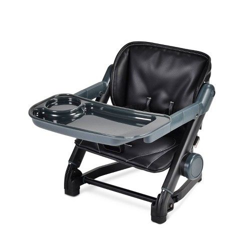 a black and gray baby high chair with tray