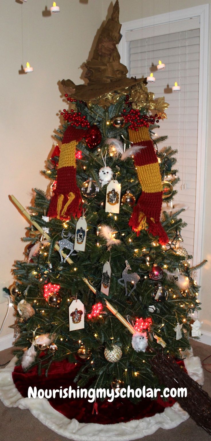 a decorated christmas tree with harry potter decorations