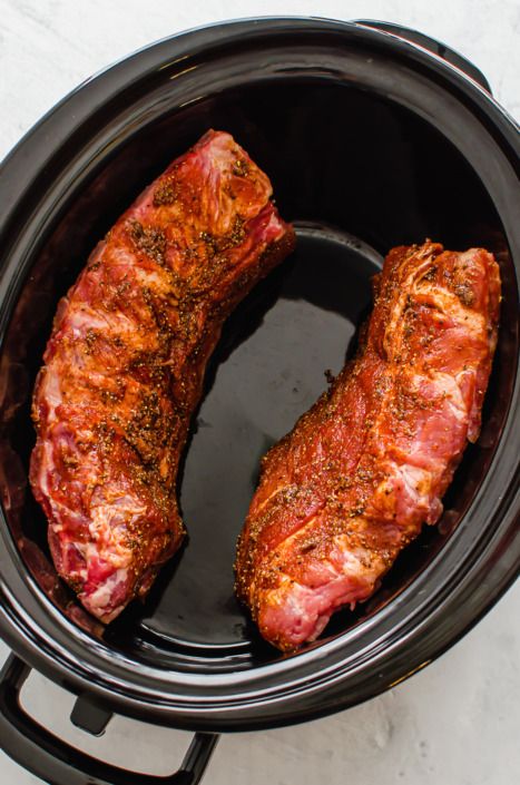 two pieces of meat in a slow cooker