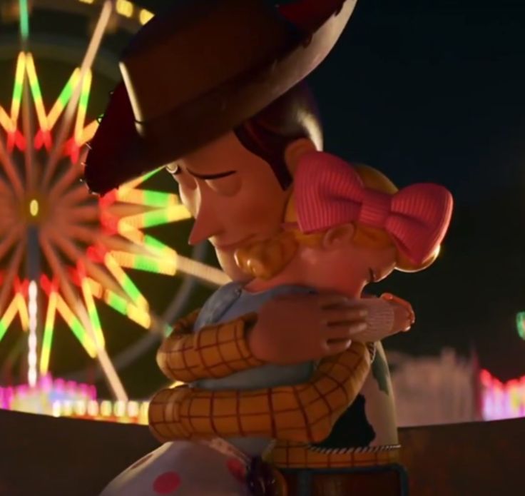 a cartoon character hugging another character in front of a ferris wheel