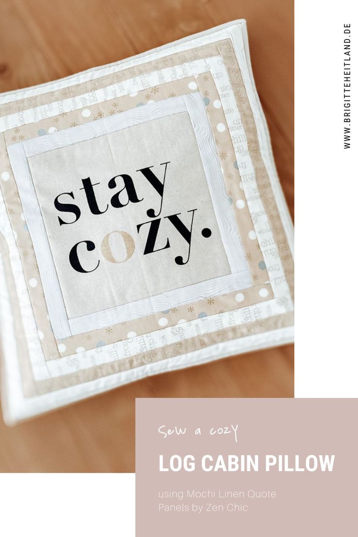 a close up of a piece of cloth on a wooden table with the words stay cozy