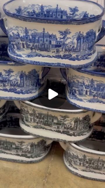 blue and white dishes stacked on top of each other