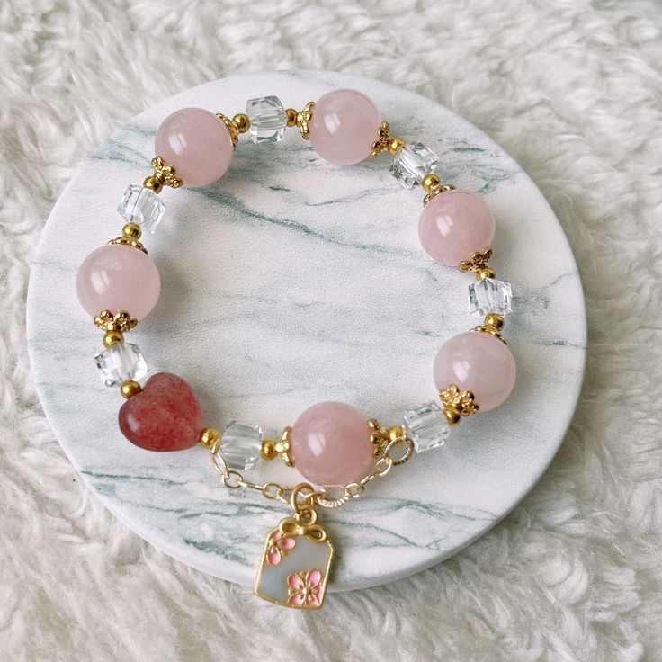 📝Material and Size Rose Quartz Beads: around 12mm Red Heart Bead is Strawberry Quartz 14k Gold Filled decoration beads Clear bead is Xilion Bicone (Also name as Swarovski crystal) Bracelet length: around 14cm 💜You will receive the exactly same bracelet as shown in the photo. 💜This handmade Jewelry listing come with an anti-oxidized jewelry box. 💜Please ensure you have no metal allergy before purchasing 💜Keep in mind these are natural stones and they may have small cracks and imperfections. Heart Bracelet With Round Beads As Gift, Heart Beaded Bracelets As Mother's Day Gift, Rose Gold Jewelry With 8mm Beads For Gift, Mother's Day Gift Beaded Bracelets With Heart Beads, Mother's Day Gift Beaded Bracelet With Heart Beads, Rose Quartz Beaded Bracelets As Gift, Heart Beads Bracelet Gift, Rose Gold Bracelets With 8mm Beads For Gift, Rose Gold Crystal Bracelet With Round Beads Gift