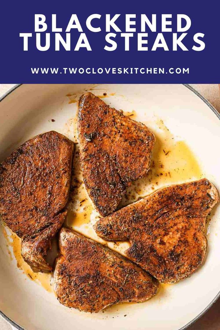 grilled tuna steaks in a skillet with lemon sauce