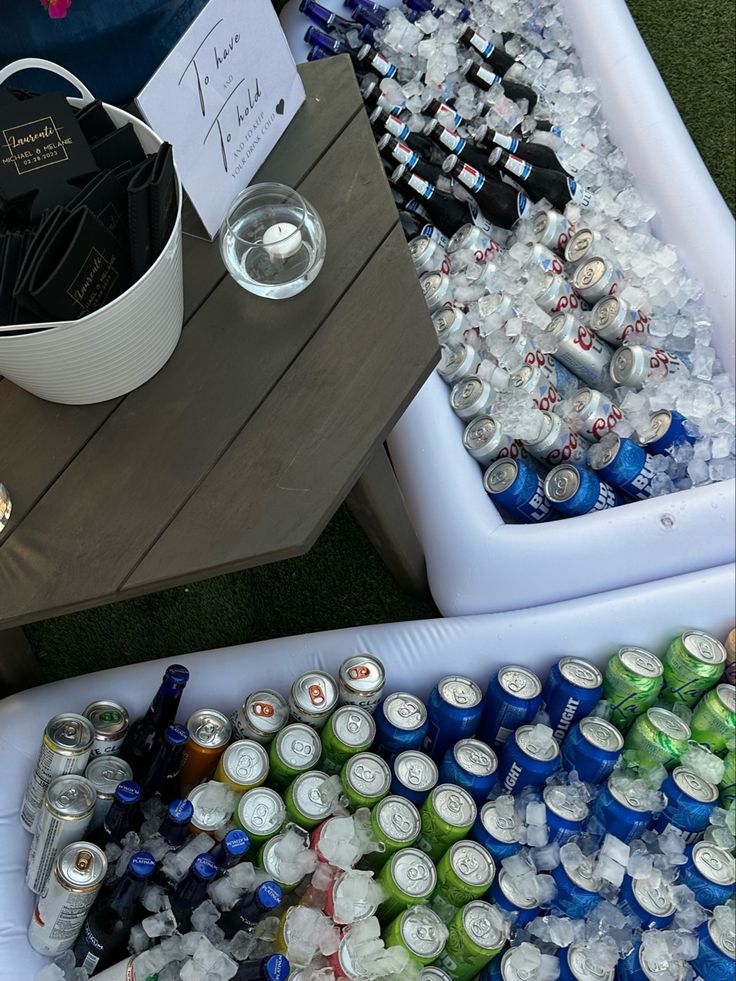 two coolers filled with lots of different types of soda and water bottles sitting next to each other