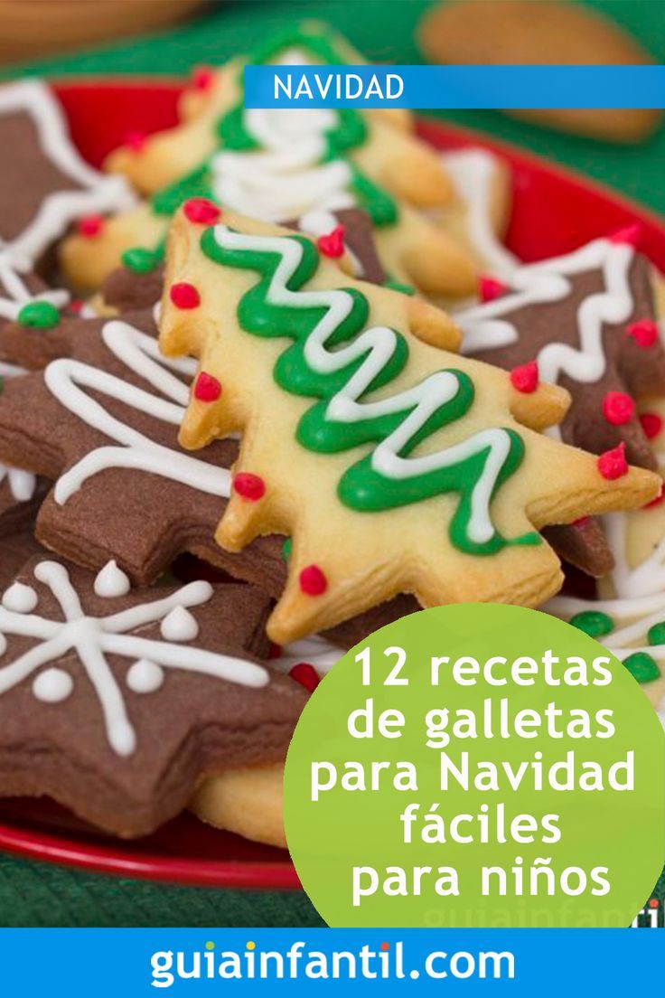 a plate full of decorated christmas cookies on a table