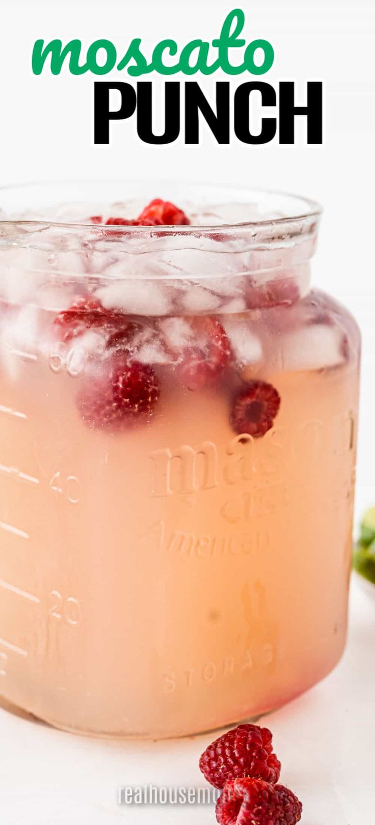 a mason jar filled with raspberry moscato punch