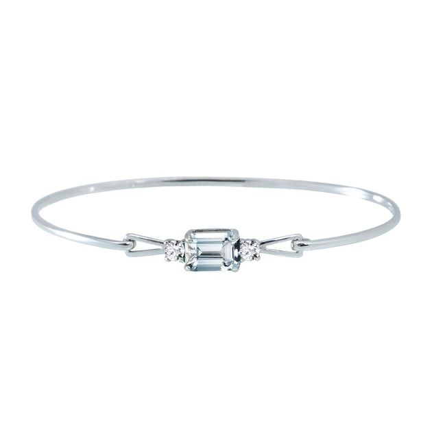 One of our most elegant bracelets is decorated with a large pale blue aquamarine in a square emerald cut complemented by a small diamond on either side. A beautiful gift for special occasions.Aquamarine was believed to be the treasure of mermaids. Be a one with this bracelet. #klenota #klenotajewelry #klenotabracelet #whitegold #14k #14carat #bracelet #aquamarine #diamond #luxurygift #aquamarinegemstone #bluestone #gemstone #diamondbracelet#jewelrymakers #prettyjewelry #inspiration Modern White Topaz Emerald Cut Jewelry, Modern Jewelry With Emerald Cut Blue Topaz, Modern Blue Topaz Jewelry Emerald Cut, Modern Blue Topaz Emerald Cut Jewelry, Emerald Cut Diamond Accented Bracelets As Gifts, Modern Emerald-cut Blue Topaz Jewelry, Emerald Cut Diamond Bracelet In White Gold As Gift, Elegant White Blue Topaz Jewelry, Fine Jewelry White Aquamarine