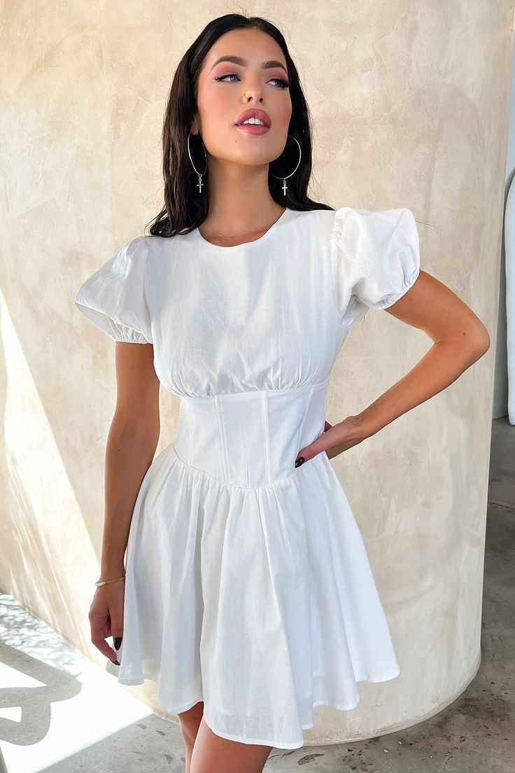 The sweetest summer mini! Offering a high neckline for extra coverage, short puffy sleeves, a fitting waist with boning details, loose fit skirt, double lined material and a back zipper. Match her with some heels and a little shoulder bag for day drinks with friends. FABRICATION: 65% Linen / 35% Cotton SIZING: Crystal's height is 163cm and wears a size AU6/US2 Summer Mini Length Puff Sleeve Dress With Smocked Back, Summer Puff Sleeve Mini Dress With Smocked Back, Summer Mini Puff Sleeve Dress With Smocked Back, Chic Puff Sleeve Dress With Gathered Sleeves For Summer, Fitted Summer Dress With Puff And Gathered Sleeves, Chic Puff Sleeve Dress With Smocked Back, Chic Summer Puff Sleeve Dress With Smocked Back, Puff Sleeve Mini Dress For Day Out, Feminine Puff Sleeve Mini Dress For Day Out