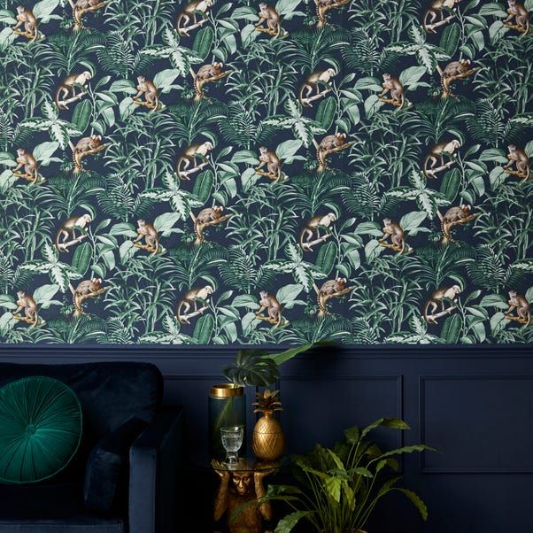 a living room with blue walls and green wallpaper